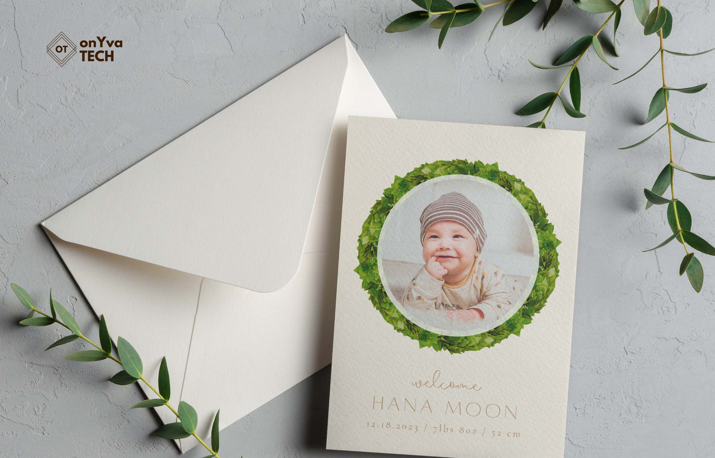 baby announcement card with a circle frame of Kukui Leaf Lei necklace around the picture.