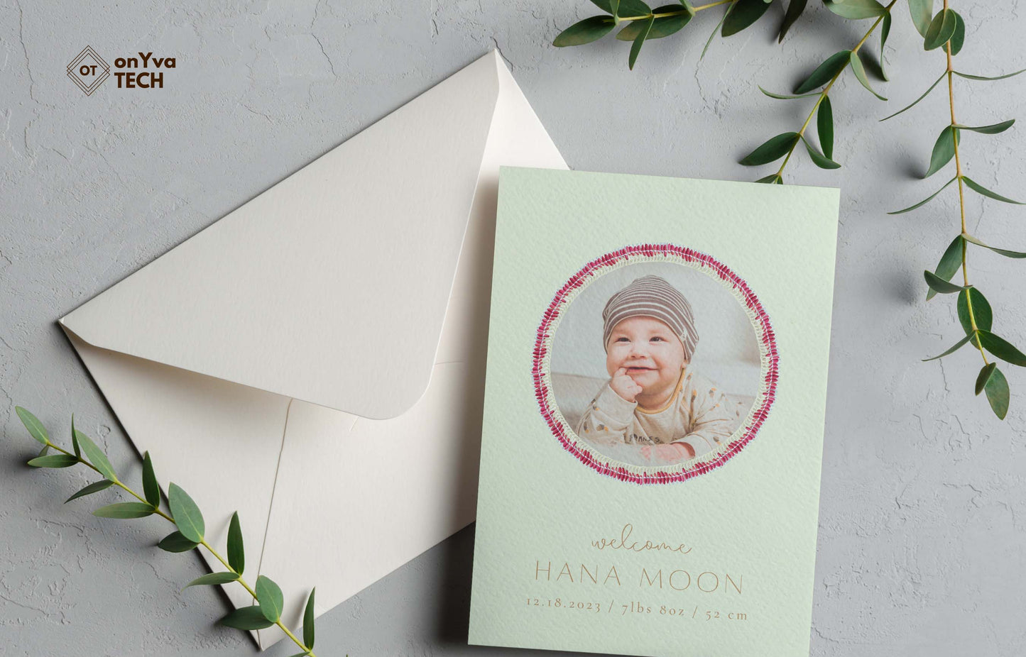 baby announcement card with a circle frame of Micronesian White Pink Ginger Lei necklace around the picture.