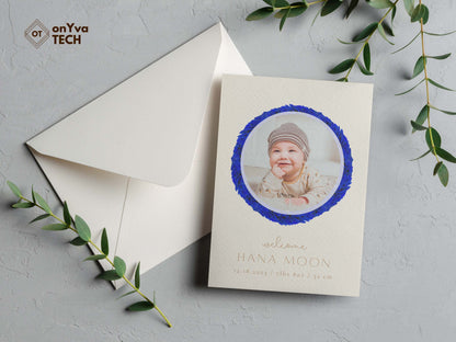  baby announcement card with a circle frame of   Lei Hulu Royal Blue necklace around the picture. 