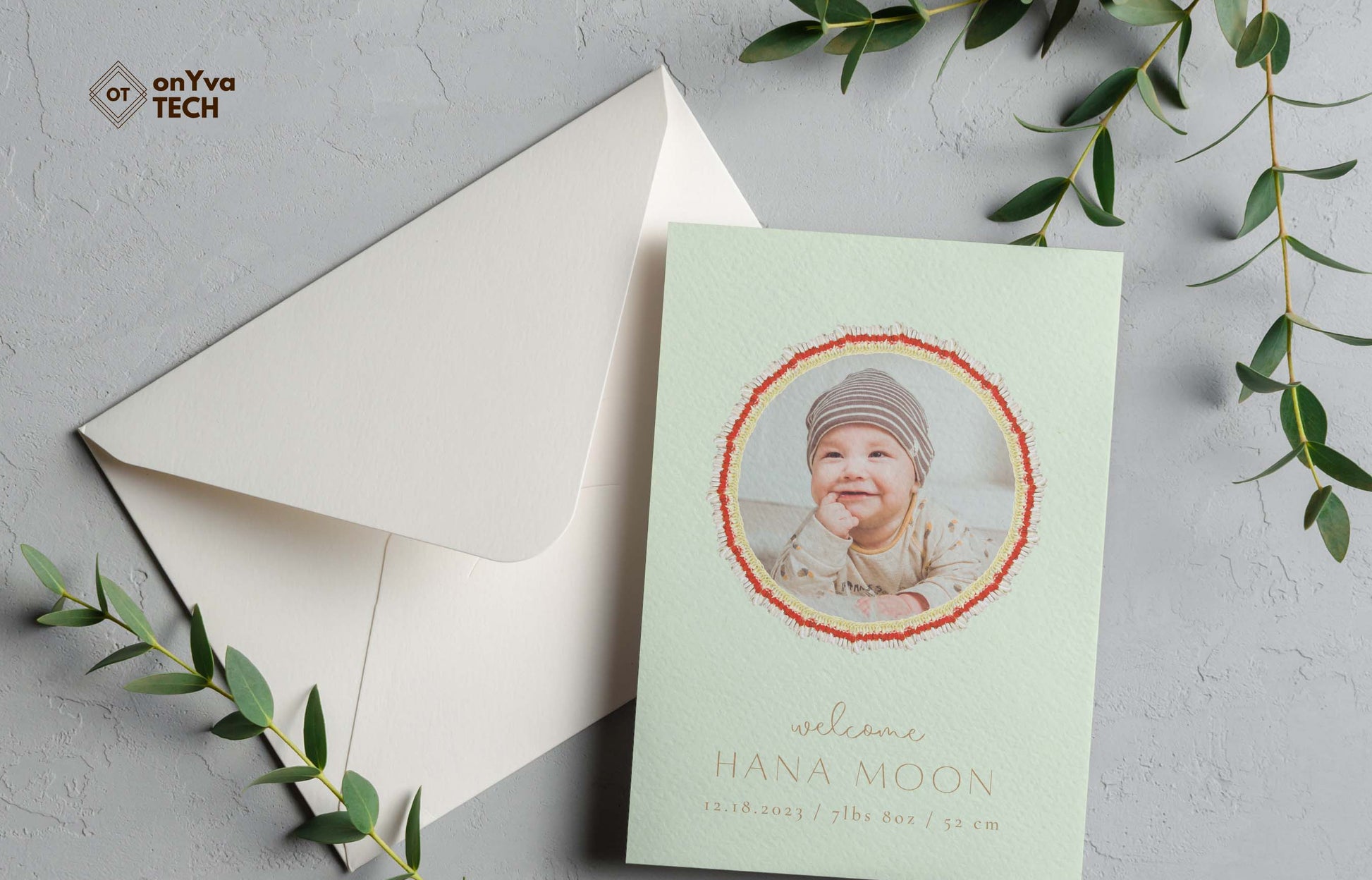  baby announcement card with a circle frame of   Micronesian White Ginger Red Carnation Lei necklace around the picture. 
