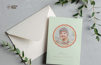  baby announcement card with a circle frame of   Micronesian White Ginger Red Carnation Lei necklace around the picture. 